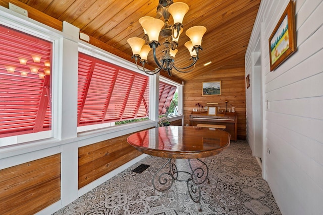 sunroom featuring a notable chandelier