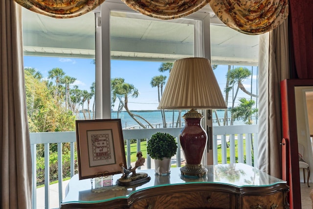 dining space featuring a wealth of natural light and a water view