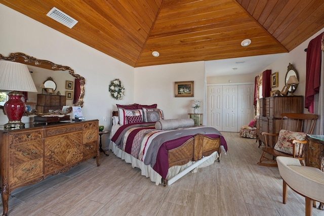 bedroom with lofted ceiling, visible vents, wood ceiling, and light wood-type flooring