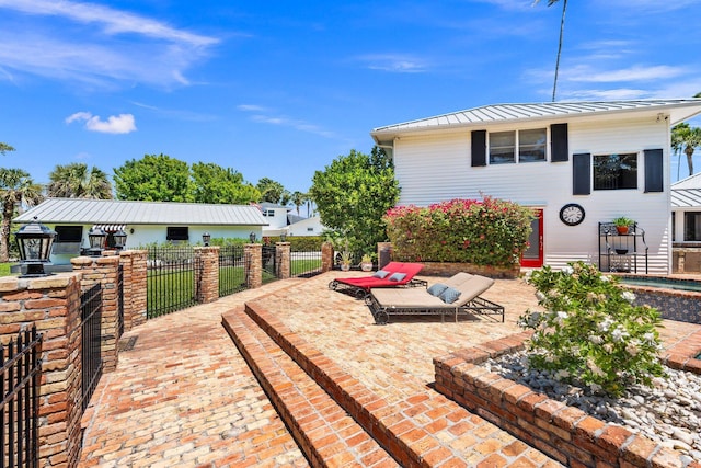 view of patio featuring fence