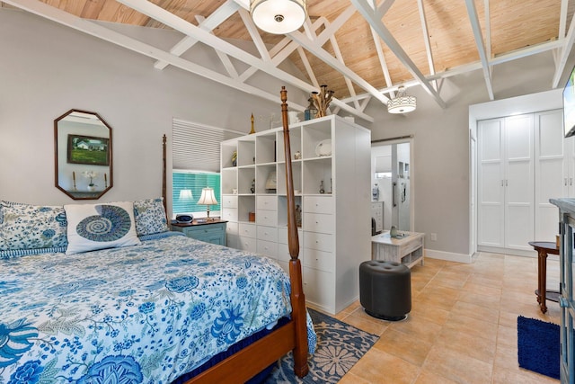 bedroom with wooden ceiling, baseboards, vaulted ceiling with beams, and light tile patterned floors