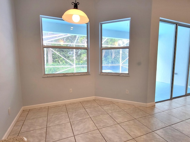 5105 E 1st Sq SW, Vero Beach, FL 32968 - spare room with light tile patterned floors and baseboards