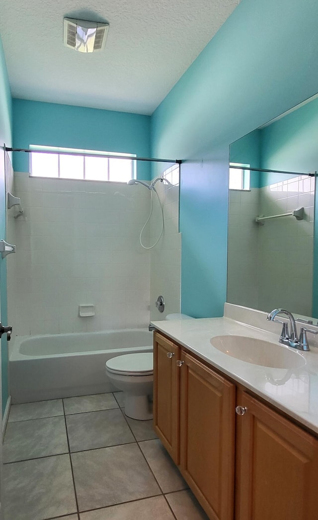 5105 E 1st Sq SW, Vero Beach, FL 32968 - full bath with vanity, toilet, tile patterned floors, bathing tub / shower combination, and visible vents
