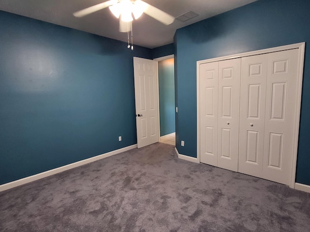 5105 E 1st Sq SW, Vero Beach, FL 32968 - unfurnished bedroom with a closet, baseboards, ceiling fan, and carpet flooring