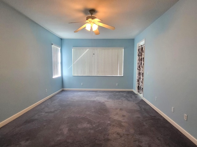 5105 E 1st Sq SW, Vero Beach, FL 32968 - empty room with carpet flooring, ceiling fan, and baseboards