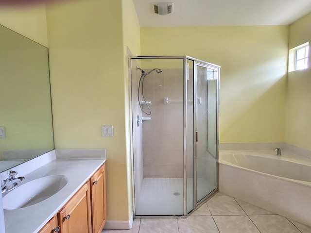5105 E 1st Sq SW, Vero Beach, FL 32968 - bathroom featuring visible vents, tile patterned flooring, vanity, a bath, and a stall shower