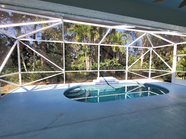 5105 E 1st Sq SW, Vero Beach, FL 32968 - pool with a ceiling fan, glass enclosure, and a patio area