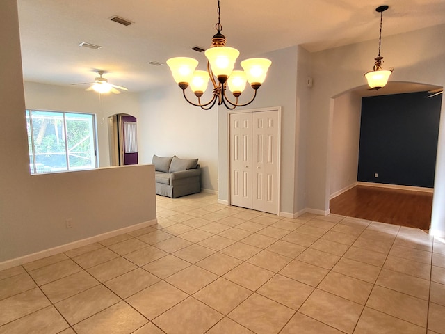 5105 E 1st Sq SW, Vero Beach, FL 32968 - unfurnished room with arched walkways, light tile patterned flooring, and visible vents