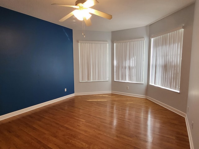 5105 E 1st Sq SW, Vero Beach, FL 32968 - unfurnished room with ceiling fan, plenty of natural light, and wood finished floors