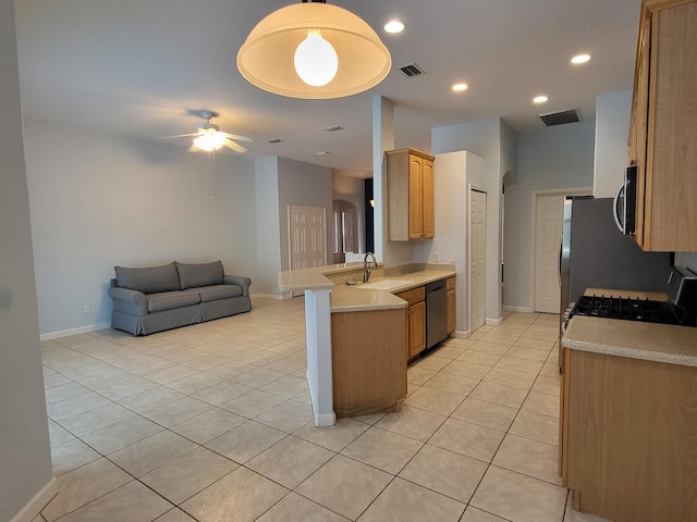 5105 E 1st Sq SW, Vero Beach, FL 32968 - kitchen featuring a sink, appliances with stainless steel finishes, light countertops, and open floor plan