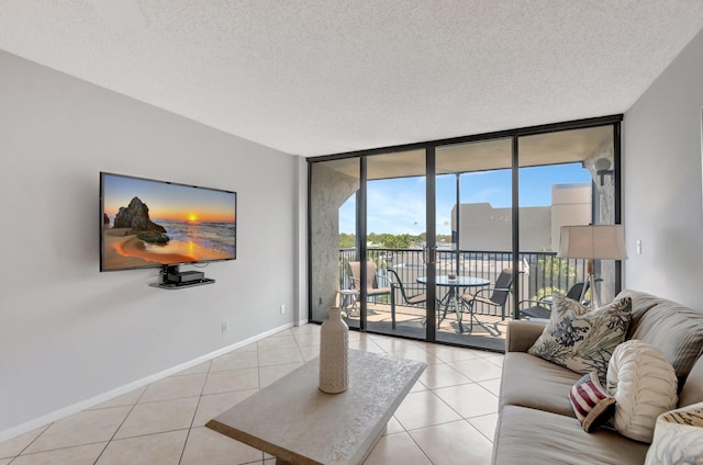15 Royal Palm Way Unit 505, Boca Raton, FL 33432 - tiled living area with baseboards, a textured ceiling, and floor to ceiling windows