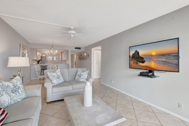 15 Royal Palm Way Unit 505, Boca Raton, FL 33432 - living room with visible vents, baseboards, ceiling fan with notable chandelier, and light tile patterned flooring