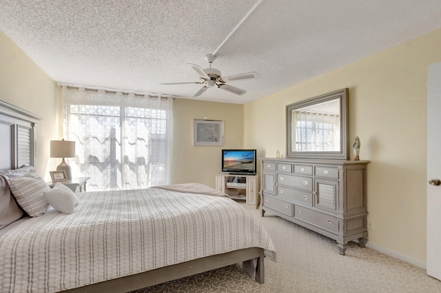 15 Royal Palm Way Unit 505, Boca Raton, FL 33432 - bedroom with baseboards, a ceiling fan, a textured ceiling, and light carpet