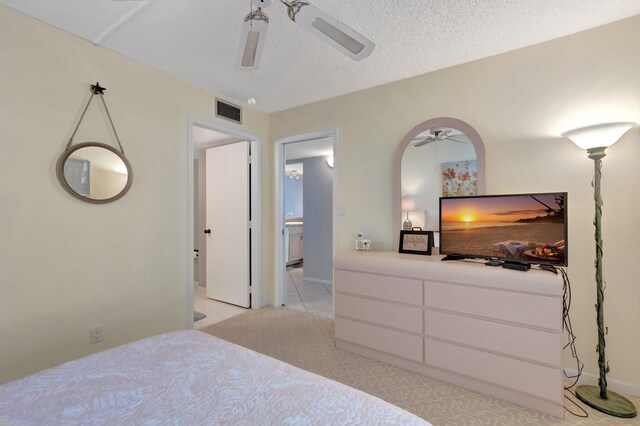 15 Royal Palm Way Unit 505, Boca Raton, FL 33432 - bedroom with ceiling fan, light carpet, a textured ceiling, and visible vents