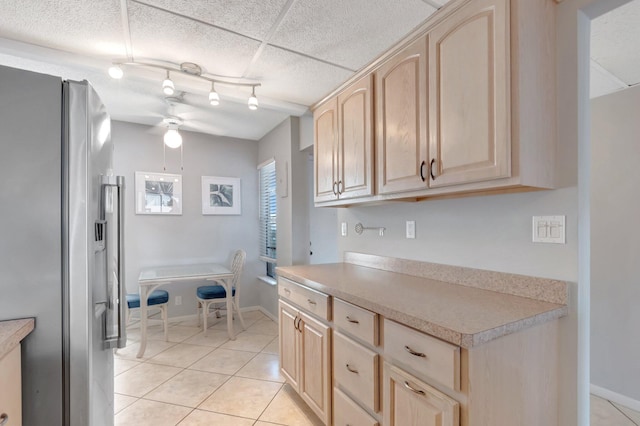 15 Royal Palm Way Unit 505, Boca Raton, FL 33432 - kitchen featuring a ceiling fan, light brown cabinetry, light countertops, stainless steel fridge, and light tile patterned flooring