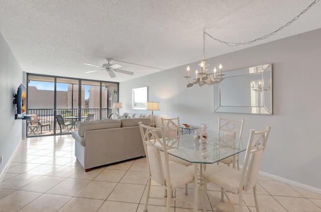 15 Royal Palm Way Unit 505, Boca Raton, FL 33432 - dining space with baseboards, a textured ceiling, ceiling fan with notable chandelier, and light tile patterned floors