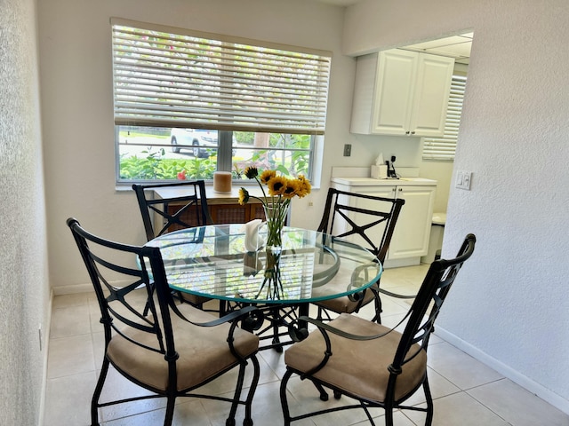 181 Ellesmere D Unit 181, Deerfield Beach, FL 33442 - dining area featuring a textured wall and light tile patterned floors