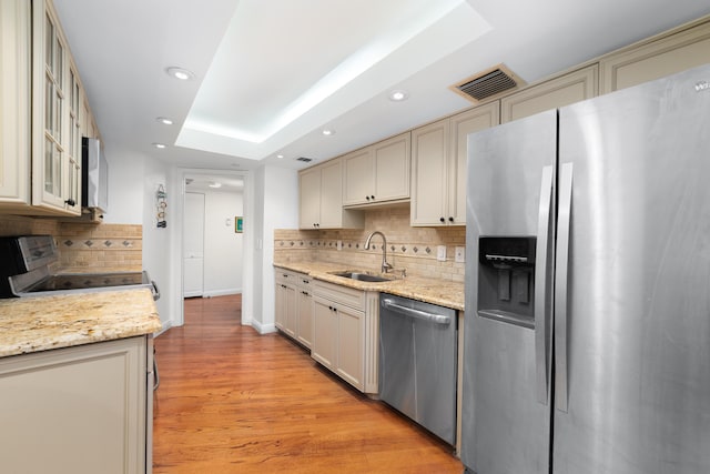 4301 N Ocean Blvd Unit 203, Boca Raton, FL 33431 - kitchen with a sink, backsplash, appliances with stainless steel finishes, visible vents, and recessed lighting
