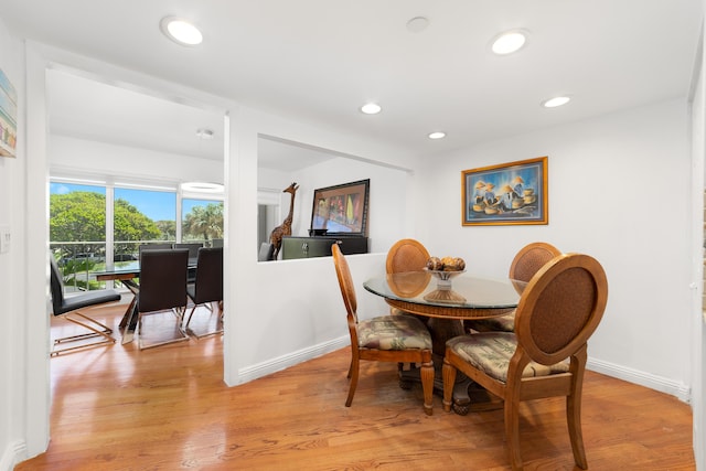 4301 N Ocean Blvd Unit 203, Boca Raton, FL 33431 - dining space with baseboards, light wood-style floors, and recessed lighting