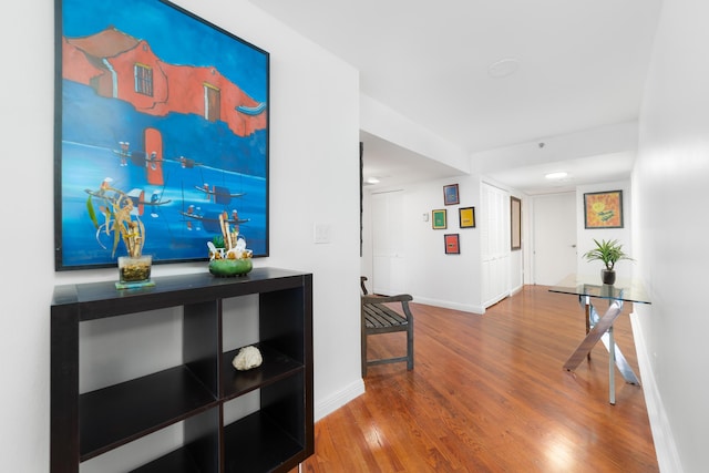 4301 N Ocean Blvd Unit 203, Boca Raton, FL 33431 - hallway with baseboards and wood finished floors