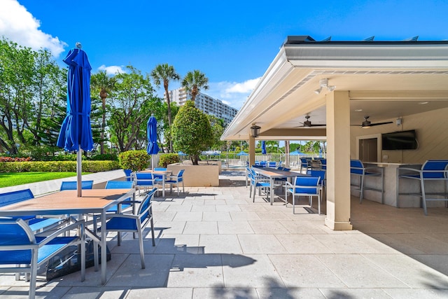 4301 N Ocean Blvd Unit 203, Boca Raton, FL 33431 - view of patio with fence, outdoor dining space, and a ceiling fan