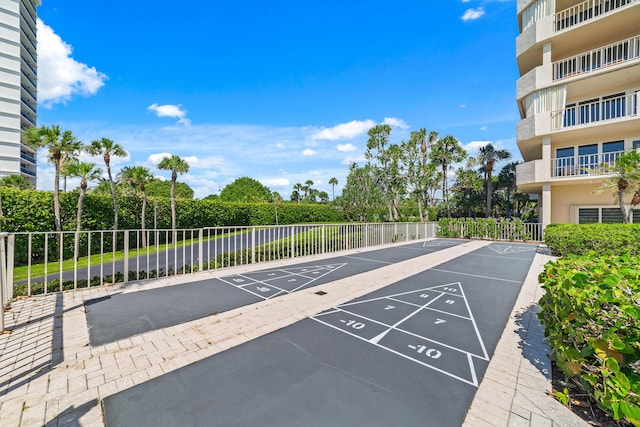 4301 N Ocean Blvd Unit 203, Boca Raton, FL 33431 - view of property's community featuring shuffleboard, uncovered parking, and fence