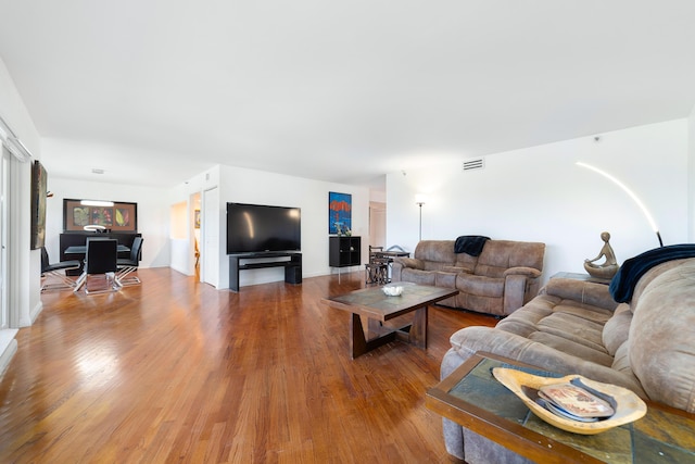 4301 N Ocean Blvd Unit 203, Boca Raton, FL 33431 - living area featuring baseboards, wood finished floors, and visible vents