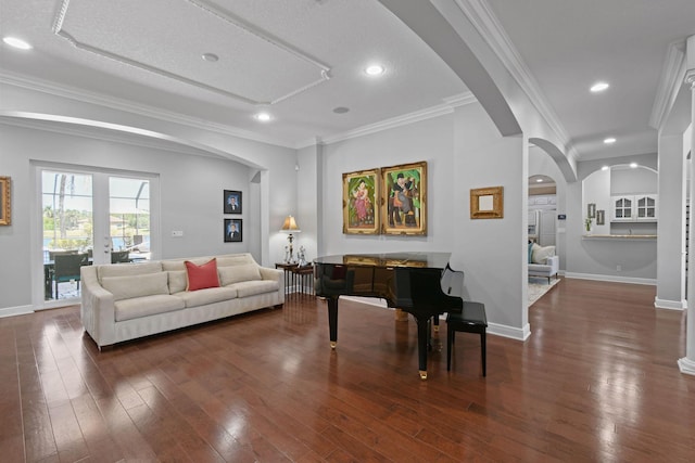 869 SW Habitat Ln, Palm City, FL 34990 - living area with arched walkways, hardwood / wood-style flooring, ornamental molding, baseboards, and recessed lighting