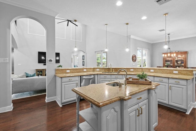 869 SW Habitat Ln, Palm City, FL 34990 - kitchen with an island with sink, a sink, dark wood-style floors, ornamental molding, and recessed lighting