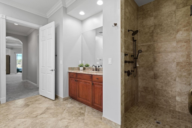 869 SW Habitat Ln, Palm City, FL 34990 - full bath featuring vanity, a tile shower, ornamental molding, baseboards, and recessed lighting