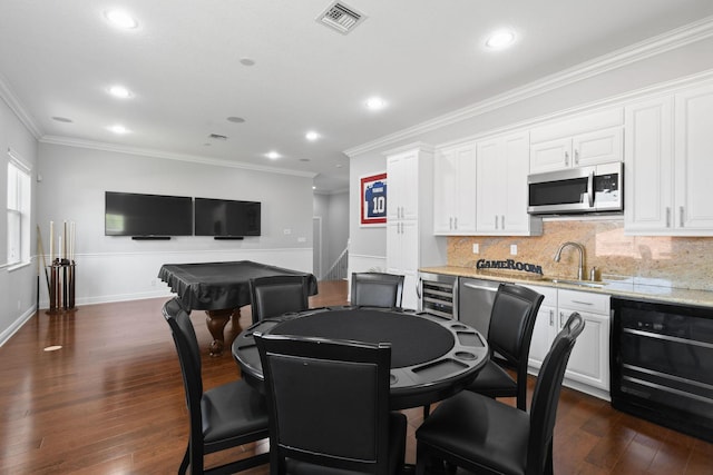 869 SW Habitat Ln, Palm City, FL 34990 - dining area with wine cooler, crown molding, recessed lighting, dark wood-style flooring, and billiards table