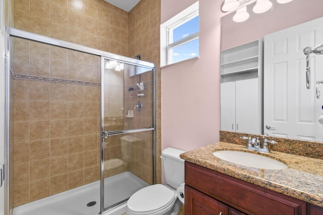869 SW Habitat Ln, Palm City, FL 34990 - bathroom with toilet, a shower stall, and vanity