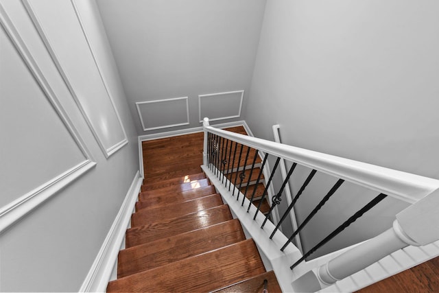 869 SW Habitat Ln, Palm City, FL 34990 - stairs featuring wood finished floors and baseboards
