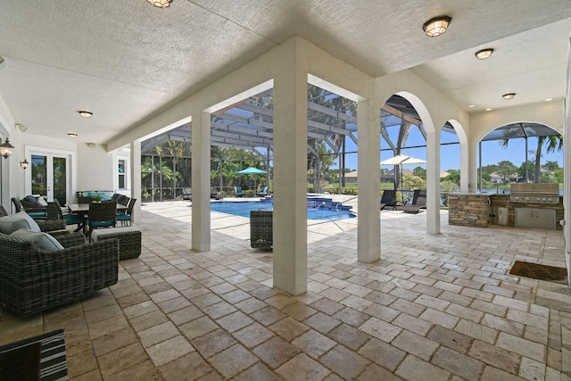 869 SW Habitat Ln, Palm City, FL 34990 - view of patio / terrace featuring a lanai, a pool with connected hot tub, outdoor dining space, and outdoor lounge area