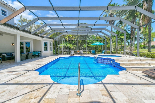 869 SW Habitat Ln, Palm City, FL 34990 - view of pool featuring outdoor lounge area, a patio area, and a pool with connected hot tub