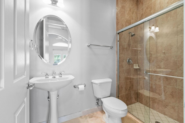 869 SW Habitat Ln, Palm City, FL 34990 - bathroom with toilet, a stall shower, and tile patterned flooring