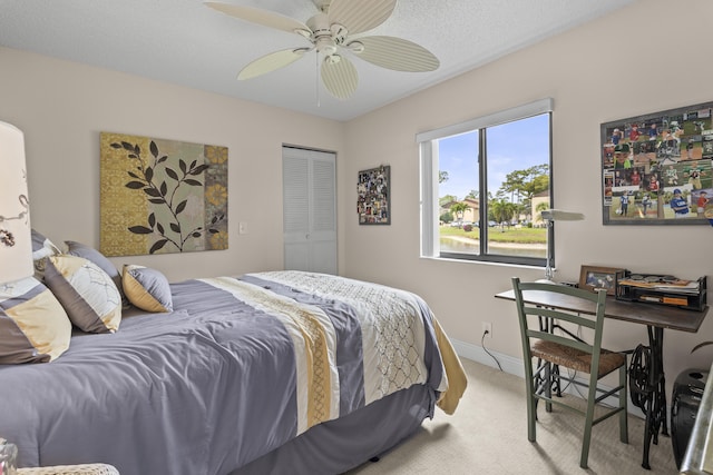 213 Pine Hov Cir Unit B-1, Greenacres, FL 33463 - bedroom featuring baseboards, light carpet, a closet, and a ceiling fan