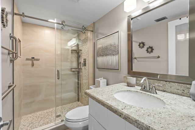 213 Pine Hov Cir Unit B-1, Greenacres, FL 33463 - full bathroom with vanity, toilet, a shower stall, and visible vents