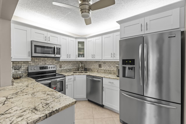 213 Pine Hov Cir Unit B-1, Greenacres, FL 33463 - kitchen featuring a sink, ceiling fan, decorative backsplash, and appliances with stainless steel finishes