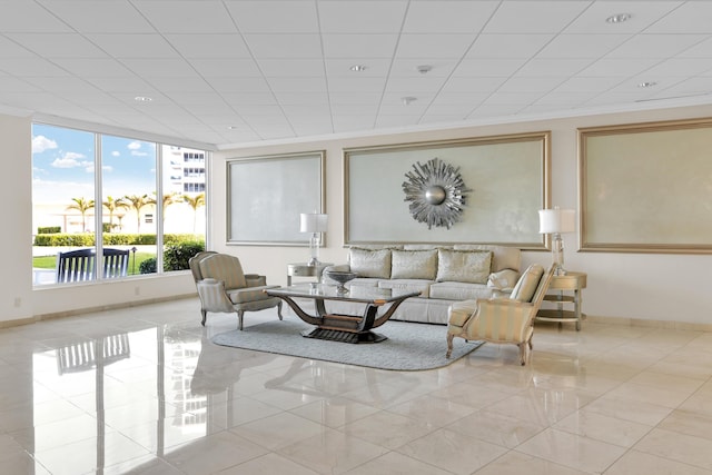 living room featuring baseboards and ornamental molding