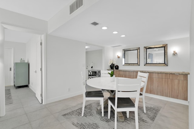 dining space featuring recessed lighting, visible vents, and light tile patterned flooring