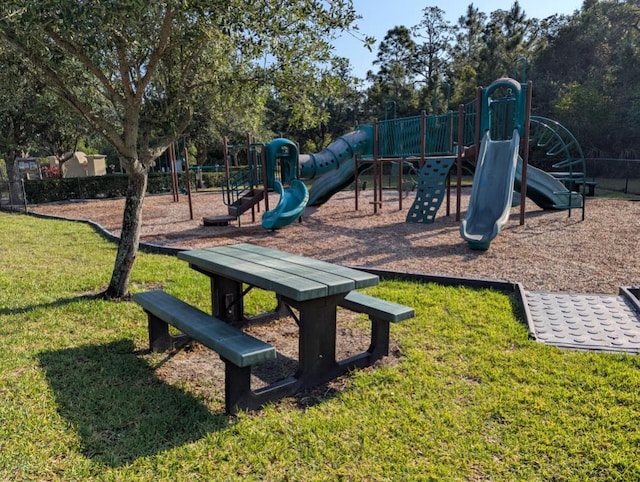 3325 Burdock Ave, Melbourne, FL 32904 - communal playground featuring a yard and fence