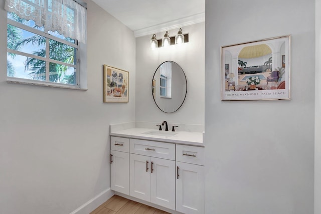 bathroom featuring vanity and baseboards