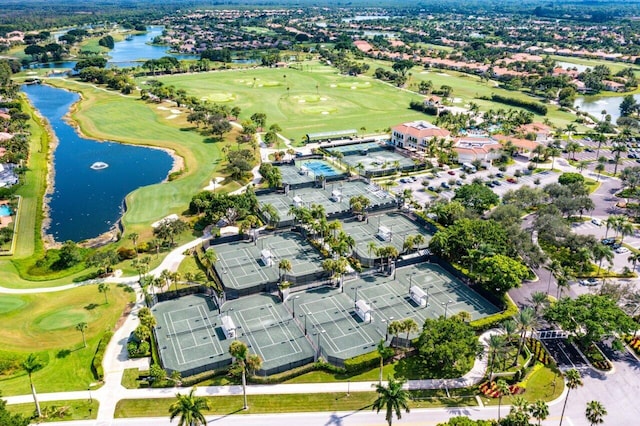 aerial view featuring golf course view and a water view