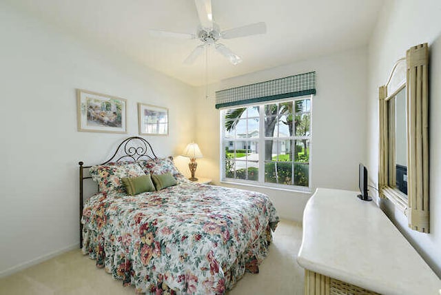 bedroom featuring carpet floors, a ceiling fan, and baseboards