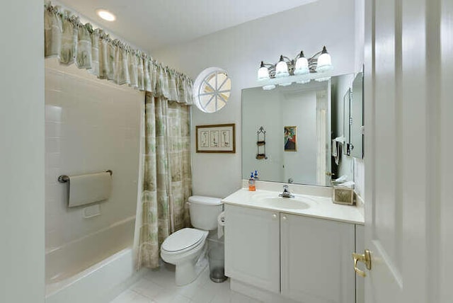 bathroom with toilet, tile patterned flooring, shower / bath combo with shower curtain, and vanity