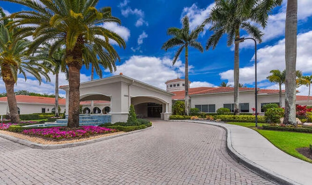 view of property with curved driveway