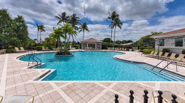 community pool with a patio area
