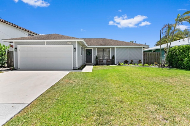 6214 Garrett St, Jupiter, FL 33458 - single story home featuring concrete driveway, an attached garage, fence, and a front yard