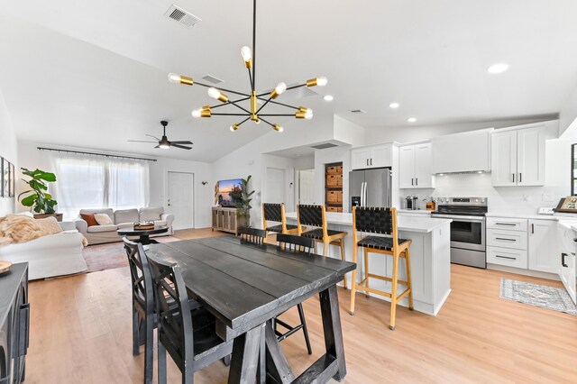 6214 Garrett St, Jupiter, FL 33458 - dining room featuring visible vents, ceiling fan with notable chandelier, recessed lighting, light wood-type flooring, and vaulted ceiling